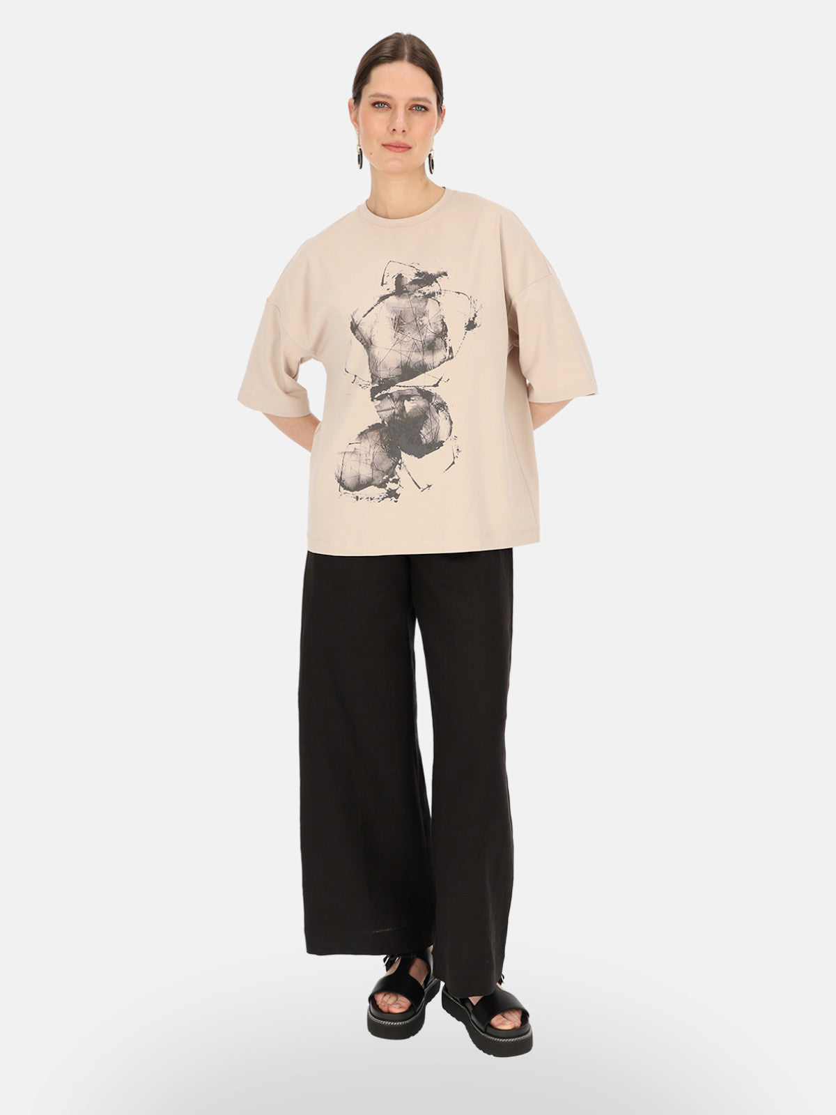 Beżowy T-shirt damski z artystycznym nadrukiem Eye For Fashion