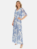 Letnia biała sukienka w niebieskie kwiaty zwiewna maxi Zoresława